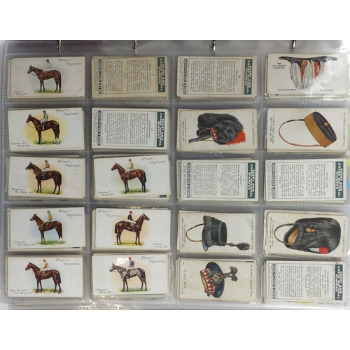 1262 - Collection of vintage cigarette cards, predominantly Players and Will's arranged in folders and albu... 