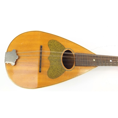 536 - Eight string melon shaped mandolin with case, inscribed Jupiter to the interior, 58.5cm in length