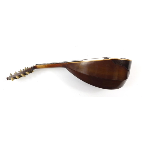 536 - Eight string melon shaped mandolin with case, inscribed Jupiter to the interior, 58.5cm in length