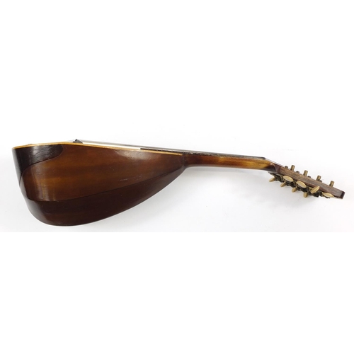 536 - Eight string melon shaped mandolin with case, inscribed Jupiter to the interior, 58.5cm in length