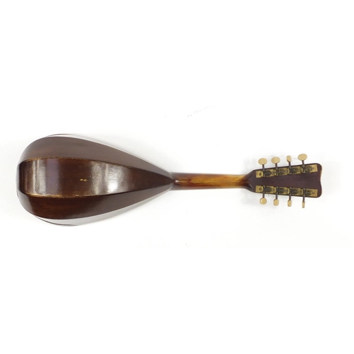 536 - Eight string melon shaped mandolin with case, inscribed Jupiter to the interior, 58.5cm in length