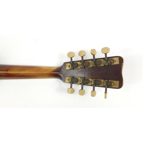 536 - Eight string melon shaped mandolin with case, inscribed Jupiter to the interior, 58.5cm in length