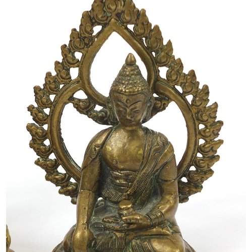 469 - Two figures of Buddha including a bronze example, possibly Thai or from Nepal, the largest 21.5cm hi... 