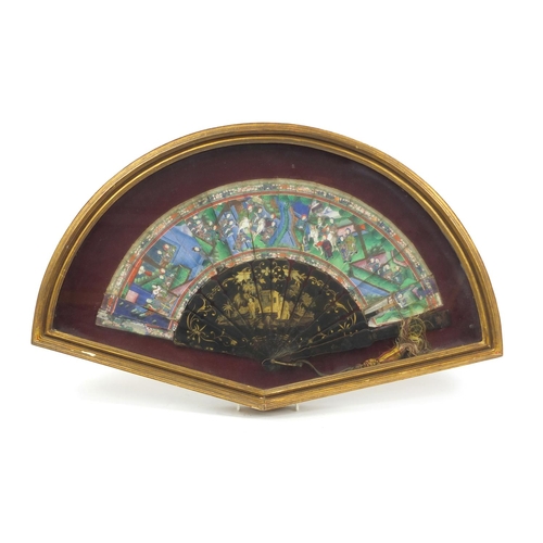 55 - Chinese brisé fan with black lacquered sticks and guards, hand painted and gilded with figures in pa... 