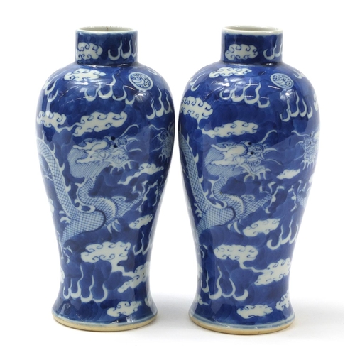 233 - Pair of Chinese blue and white porcelain baluster vases hand painted with dragons amongst clouds, fo... 