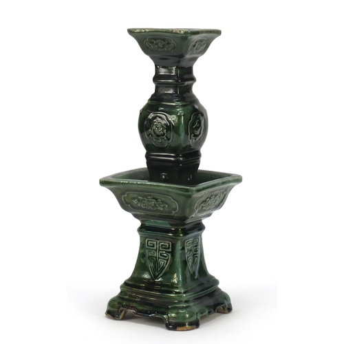 3778 - Large Chinese archaic style candlestick having a green glaze, 38cm high