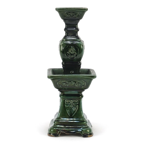 3778 - Large Chinese archaic style candlestick having a green glaze, 38cm high