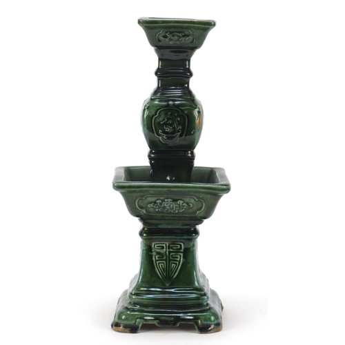 3778 - Large Chinese archaic style candlestick having a green glaze, 38cm high