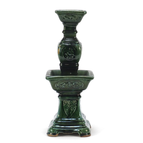 3778 - Large Chinese archaic style candlestick having a green glaze, 38cm high