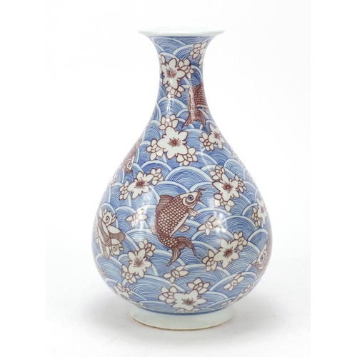 461 - Chinese blue and white porcelain vase with iron red,  hand painted with fish amongst waves and flowe... 