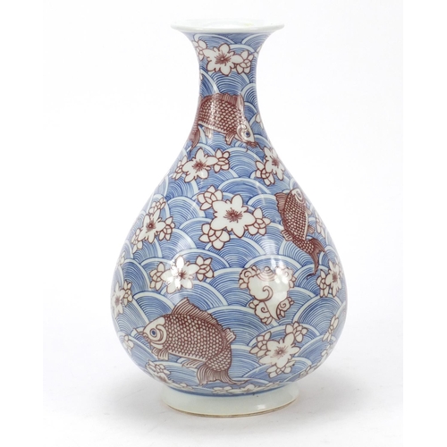 461 - Chinese blue and white porcelain vase with iron red,  hand painted with fish amongst waves and flowe... 