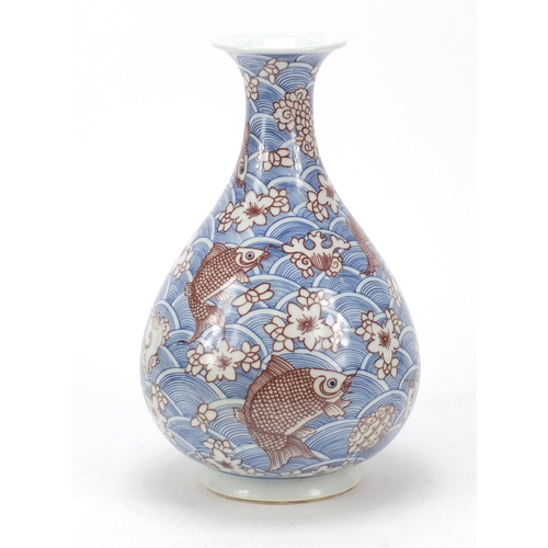 461 - Chinese blue and white porcelain vase with iron red,  hand painted with fish amongst waves and flowe... 