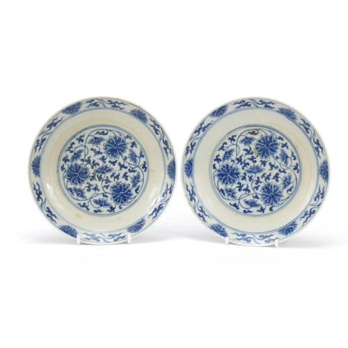 235 - Pair of Chinese blue and white porcelain dishes finely hand painted with flower heads amongst scroll... 