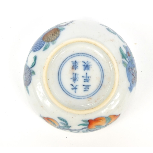 49 - Chinese doucai porcelain shallow dish hand painted with fruit, six figure character marks to the bas... 