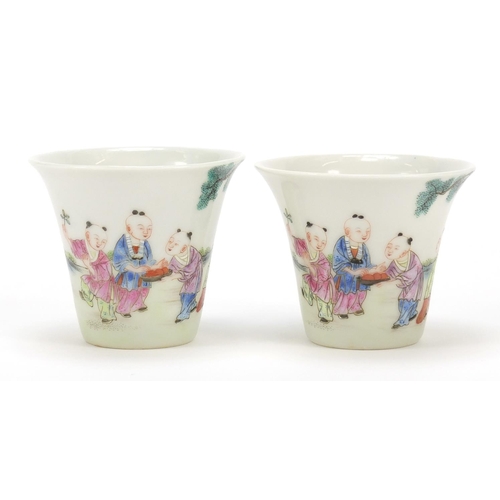 465 - Good pair of Chinese porcelain tea cups hand painted in the famille rose palette with children playi... 