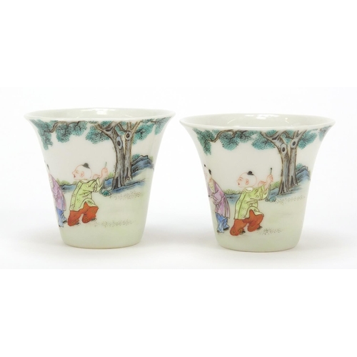 465 - Good pair of Chinese porcelain tea cups hand painted in the famille rose palette with children playi... 