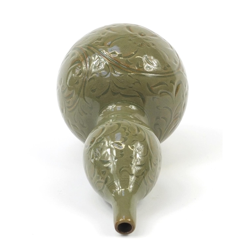 515 - Korean stoneware double gourd vase having a celadon glaze, incised with floral motifs, 33.5cm high