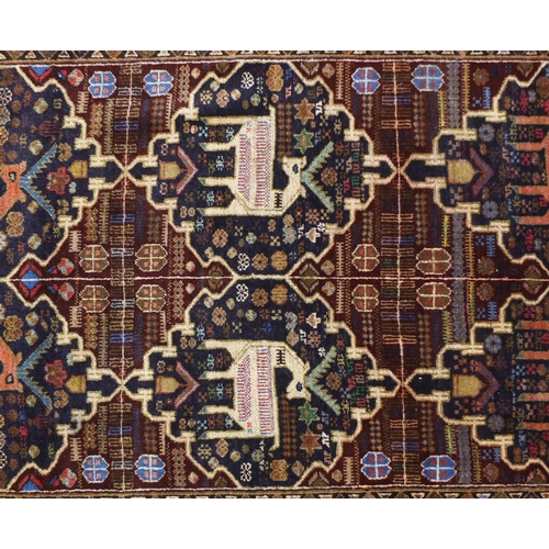 1476 - Rectangular Afghan Baluch rug decorated with a deer amongst flowers, 188cm x 123cm