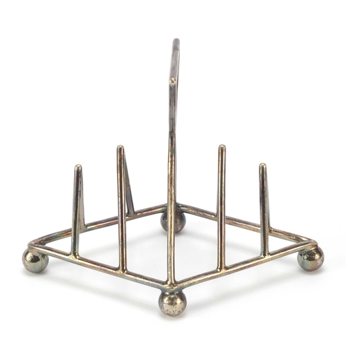 10 - Silver plated toast rack in the manner of Christopher Dresser, Numbered 1965, 10cm high