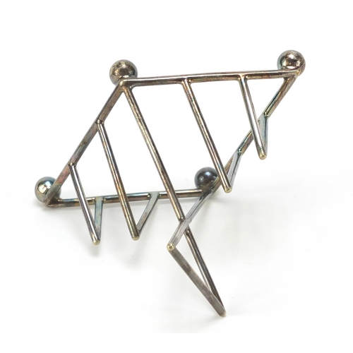 10 - Silver plated toast rack in the manner of Christopher Dresser, Numbered 1965, 10cm high