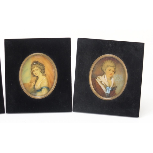 29 - Three oval hand painted portrait miniatures including one of a gentleman in naval dress, each housed... 