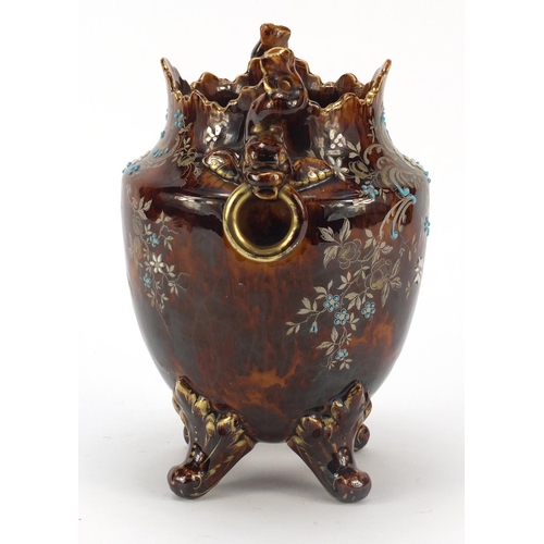 491 - Aesthetic treacle glazed cache pot with dolphin handles, hand painted and enamelled with stylised fl... 