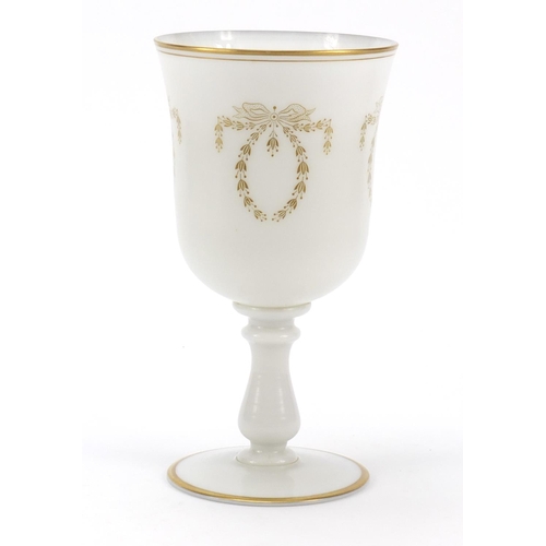 488 - Large Victorian milk glass goblet gilded with bows and swags, 25cm high