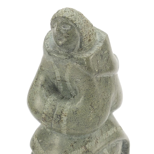 315 - Annie Qimirpik, Canadian Inuit Steatite stone carving of a woman, raised on black slate plinth base,... 