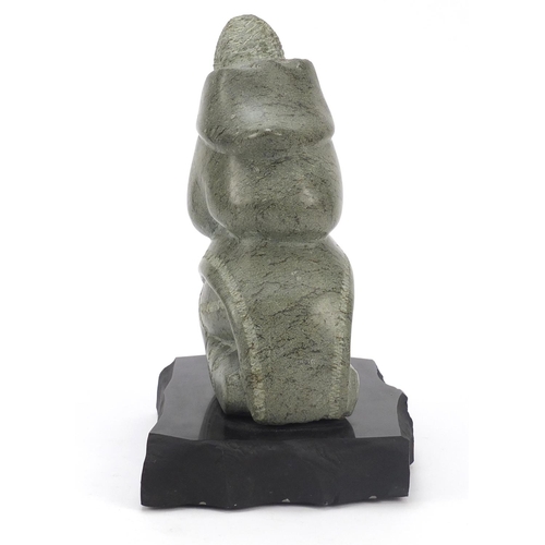 315 - Annie Qimirpik, Canadian Inuit Steatite stone carving of a woman, raised on black slate plinth base,... 