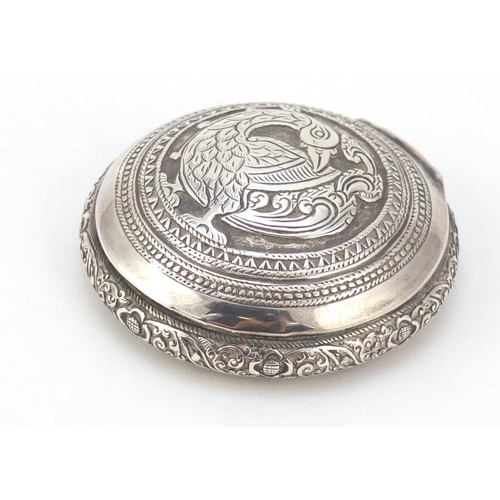 3084 - Persian silver snuff box, the hinged lid embossed with a bird of paradise, impressed marks to the in... 