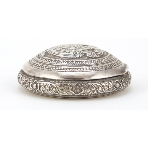 3084 - Persian silver snuff box, the hinged lid embossed with a bird of paradise, impressed marks to the in... 