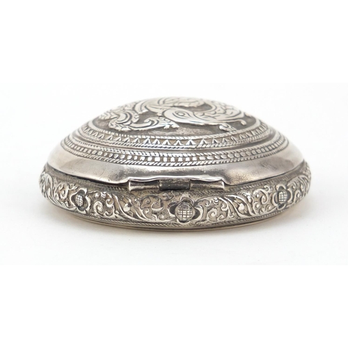 3084 - Persian silver snuff box, the hinged lid embossed with a bird of paradise, impressed marks to the in... 