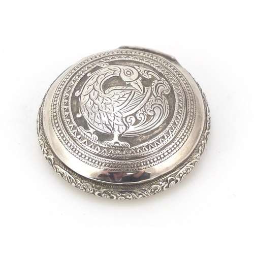 3084 - Persian silver snuff box, the hinged lid embossed with a bird of paradise, impressed marks to the in... 