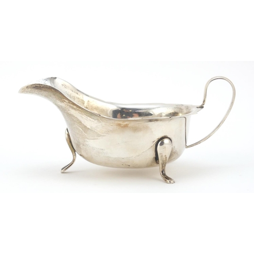 3064 - Viner's Ltd, George V silver sauce boat, raised on three feet, Sheffield 1932, 15cm wide, 131.5g