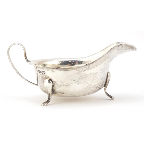 3064 - Viner's Ltd, George V silver sauce boat, raised on three feet, Sheffield 1932, 15cm wide, 131.5g