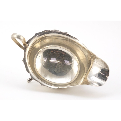 3064 - Viner's Ltd, George V silver sauce boat, raised on three feet, Sheffield 1932, 15cm wide, 131.5g