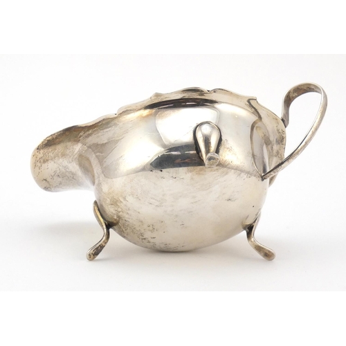 3064 - Viner's Ltd, George V silver sauce boat, raised on three feet, Sheffield 1932, 15cm wide, 131.5g