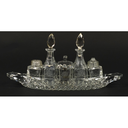 103 - Cut glass boat cruet stand with bottles, 31cm wide