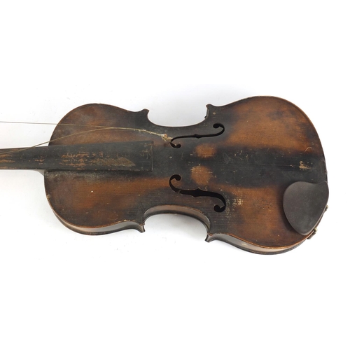 534 - Old wooden violin with scrolled neck, the violin back 14 inches in length