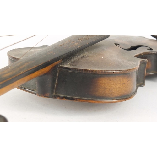 534 - Old wooden violin with scrolled neck, the violin back 14 inches in length