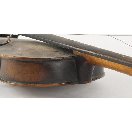 534 - Old wooden violin with scrolled neck, the violin back 14 inches in length