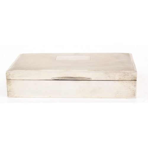 3037 - Harman Brothers, silver cigarette box, the hinged lid with engine turned decoration, Birmingham 1973... 