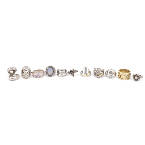 2353 - Eleven silver designer type rings, some set with semi precious stones, various sizes, 80.0g