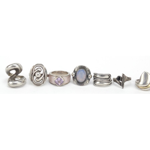 2353 - Eleven silver designer type rings, some set with semi precious stones, various sizes, 80.0g