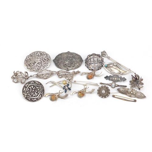 2403 - Victorian and later silver and white metal brooches, the largest 8cm in length, total 124.0g