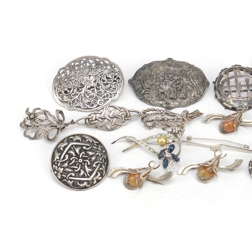 2403 - Victorian and later silver and white metal brooches, the largest 8cm in length, total 124.0g