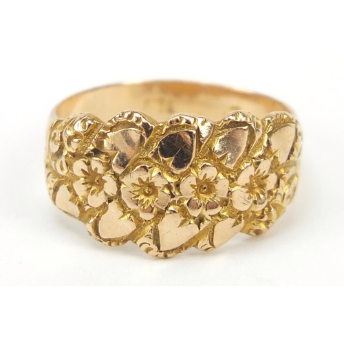 2303 - Unmarked gold flower head and love heart ring, size O, 4.2g