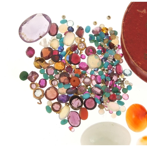 2933 - Loose semi precious stones including sapphire, rubies, turquoise, opal, amethyst, carnelian, jade an... 
