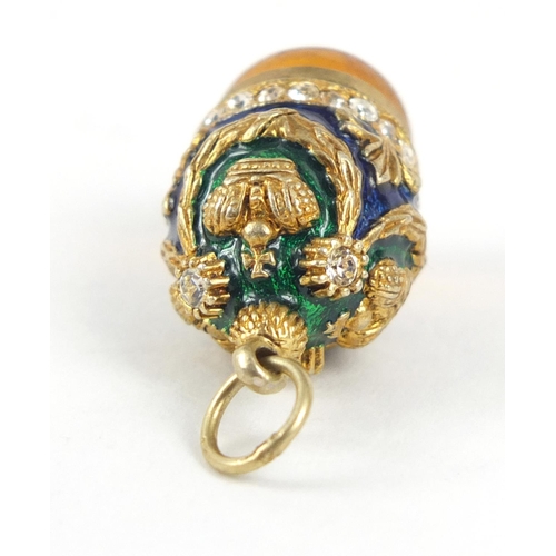 2351 - Russian unmarked silver gilt enamel and amber egg pendant, 3cm in length, 8.0g