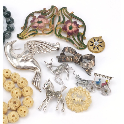 2932 - Vintage and later jewellery including an enamelled two piece buckle, marcasite brooches and a carved... 